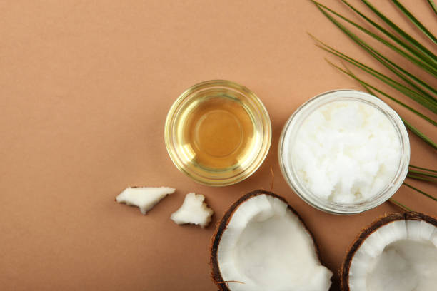 istock coconut oil and coconuts on the table 1263648375