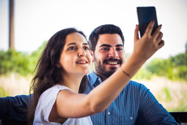 istock Young couple taking a selfie 1263648418