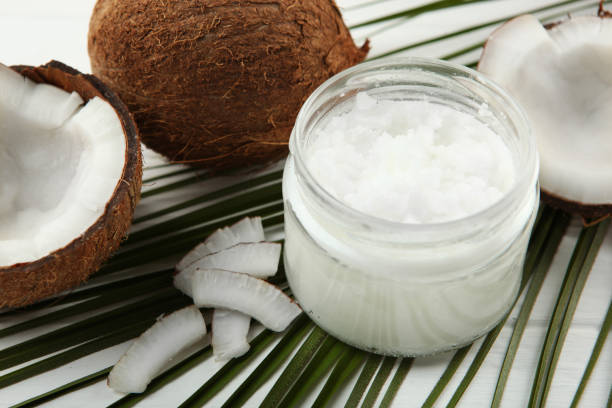 istock coconut oil and coconuts on the table 1263648553