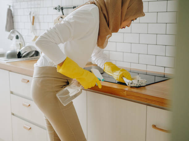 istock Muslim girl cleaning cooktop cooking panel on kitchen. 1263649743