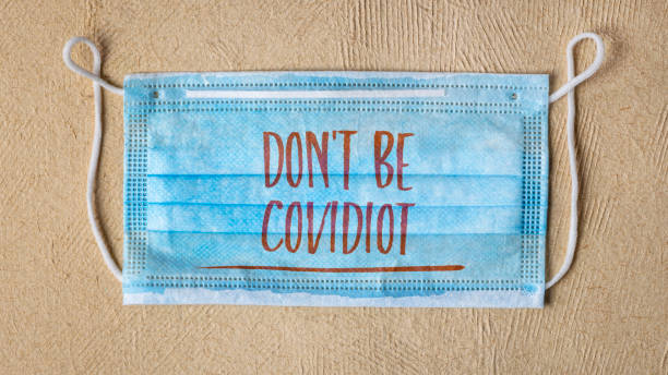 istock do not be covidiot - text on a face mask 1263655443