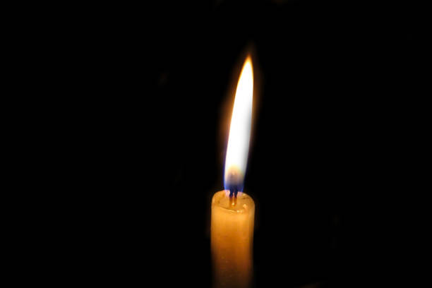 istock Candle in the dark background 1263656604