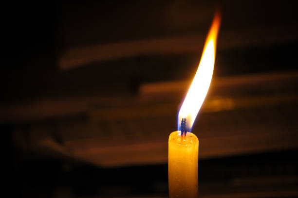 istock Candle in the dark background 1263656628