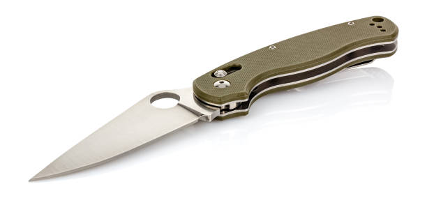 istock Lying open folding pocket knife with matte blade and dark green composite plastic cover plates on steel handle isolated on white background with reflection on glossy surface. Pocket knife close-up 1263658394