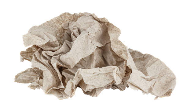 Crumpled cheap grey toilet paper isolated on white background