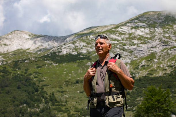 istock Active Senior Man Hiking in Mountains in Summer 1263660793