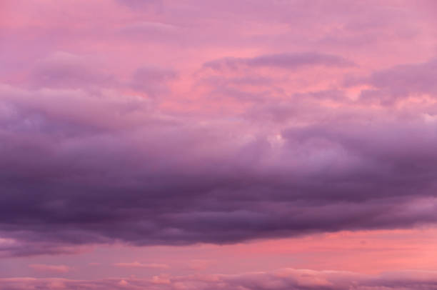 istock Intense purple and pink coloured cloudscape, sunset or sunrise scyscape 1263664459