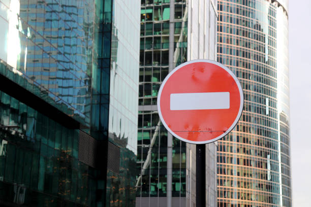 istock No entry sign on the skyscrapers background, entry is prohibited 1263666893