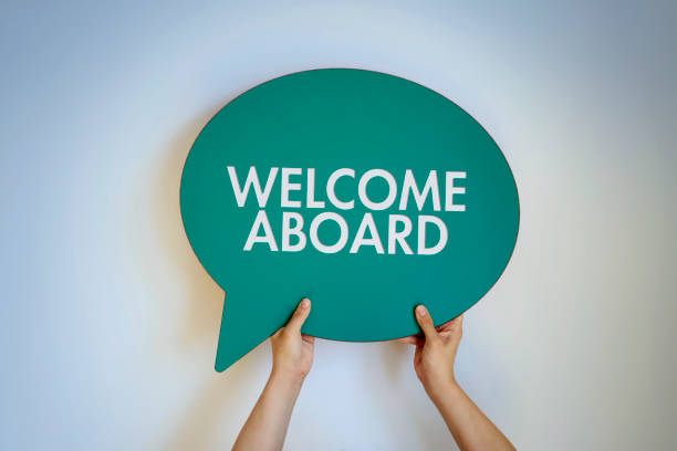 Welcome Aboard Hand holding the WELCOME ABOARD written speech bubble hello single word photos stock pictures, royalty-free photos & images