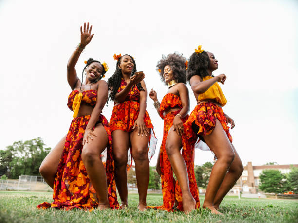 istock Young black women dancing in the field 1263672949