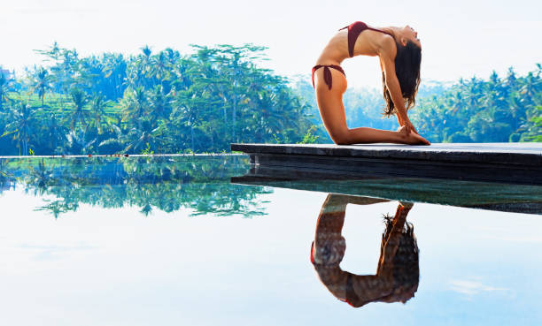 istock Young yoga woman stretching back in ustrasana camel pose 1263673150
