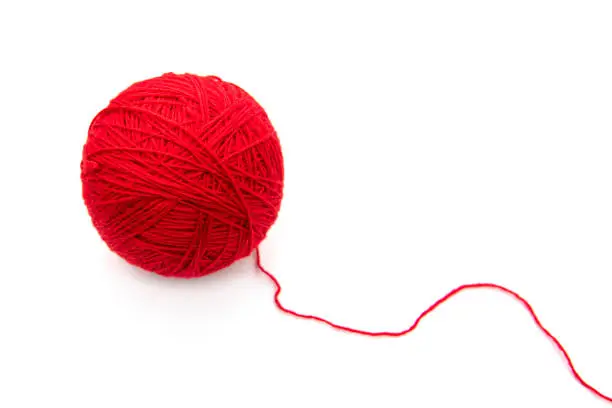 Photo of Red ball with woolen threads isolated on white background