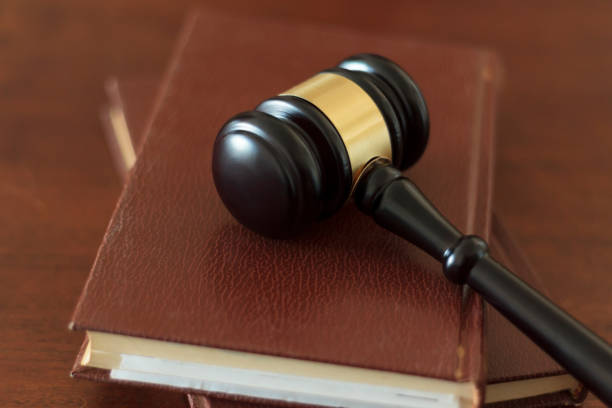 istock Judge's gavel lying on law books. Top view 1263675169