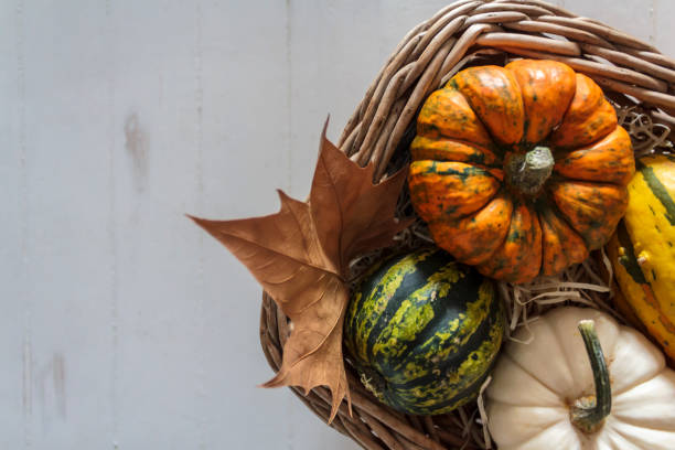istock Top view of Basket with pumpkins on rustic table 1263675185