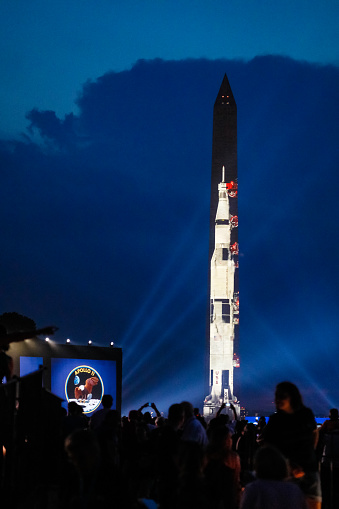 Washington D.C, USA-July 20, 2019: Crowds gather to watch the Washington Monument turn into an outdoor display to commemorate the Apollo Moon Landing's 50th Anniversary put on by the Smithsonian. The National Mall was packed with spectators who watched a real time recreation of the moon landing set exactly to the anniversary's timeline of the event 50 years ago. The National Mall is an outdoor park located in between the Capitol and the Lincoln Memorial.