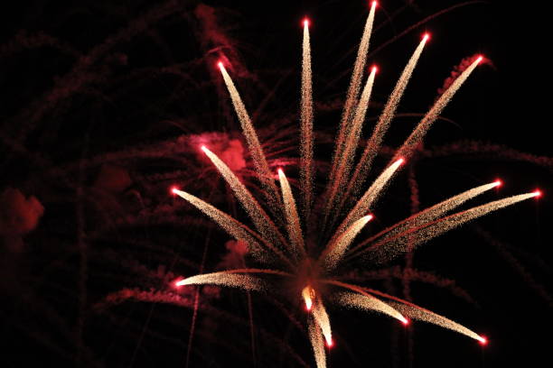 istock Gold and red sparkling Fireworks in Black Sky 1263678217