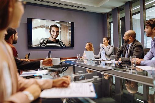 Video conferencing during meeting with remote colleagues