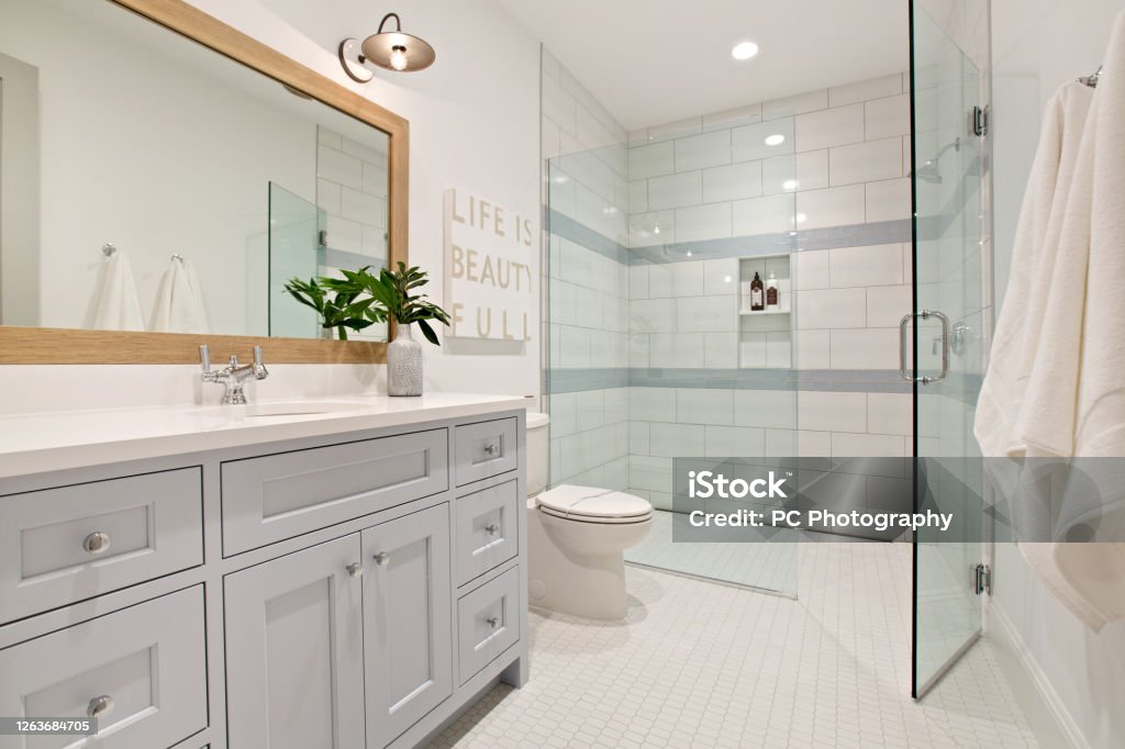 Gorgeous shower with no step up Sleek design in well planned bathroom Bathroom Stock Photo