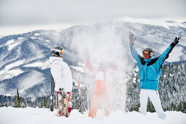 istock Skiers team having fun in snowy mountains. 1263685246