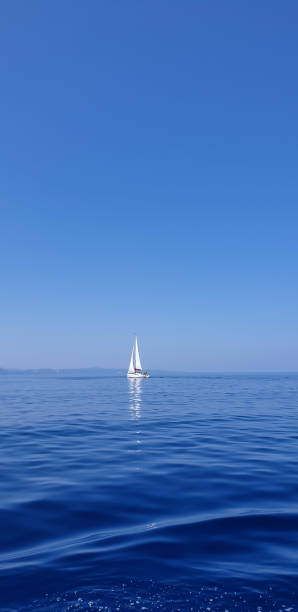 istock Sail boat in blue sea against blue sky 1263687122
