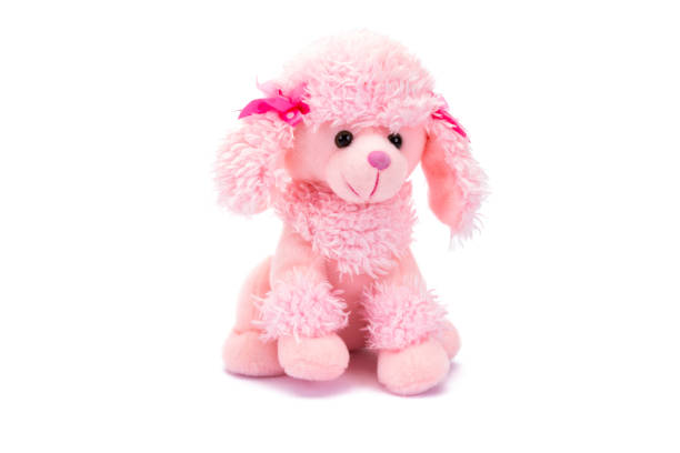 istock Pink plush puppy with shadow sitting on white background. 1263688995