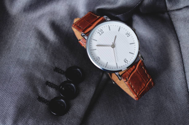 istock Stylish men's watch on a suit, top view 1263689112