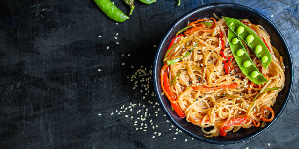 istock rice noodles with vegetables cellophane pasta second course food background top view copy space for text eating healthy 1263689141