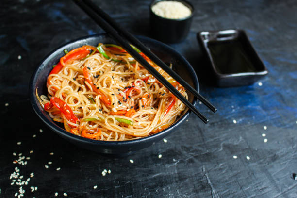 istock rice noodles with vegetables cellophane pasta second course food background top view copy space for text eating healthy 1263689142