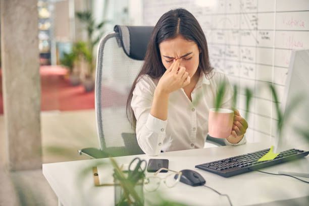 istock Negative delighted female sitting at her workplace 1263689436