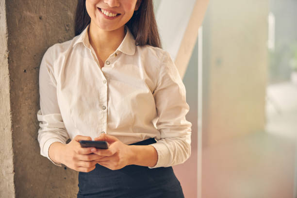 istock Pleased young brunette woman posing on camera 1263689518