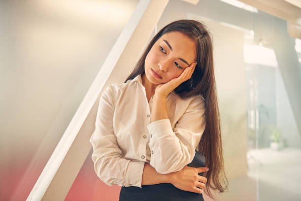 istock Bored longhaired female person touching her head 1263689526