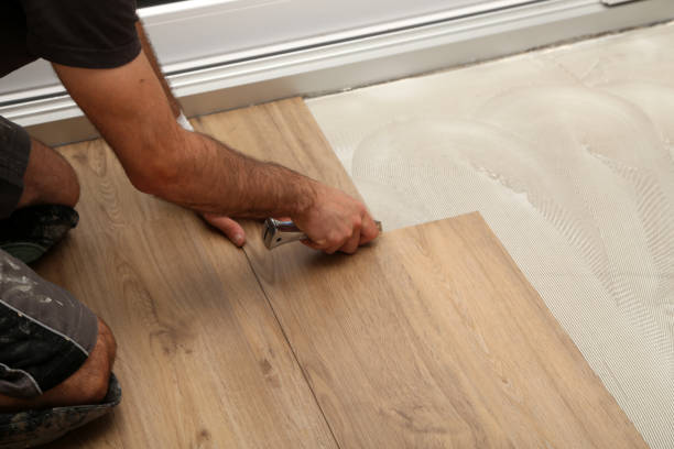 istock The worker installing new vinyl tile floor 1263691851