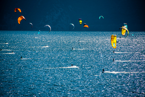 kitesurfing in the early morning on Lake Garda in Limone sul Garda, Brescia, Italy