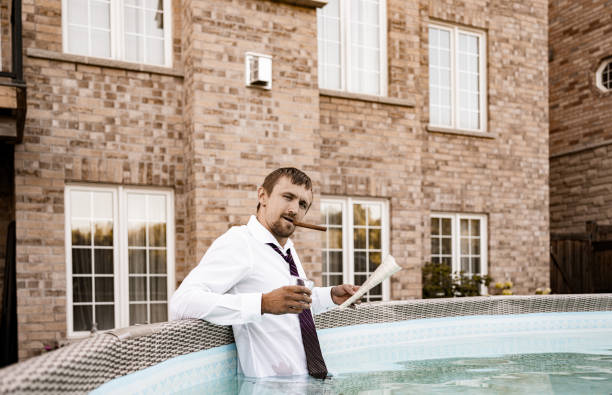 istock Young Oligarch in his pool 1263695882