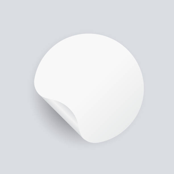 istock Round adhesive stickers with curved corner. Blank mockup circle sticky label. 1263696010