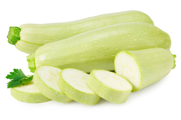 fresh green zucchini or marrow with slices and parsley isolated on white background - zucchini squash marrow squash vegetable imagens e fotografias de stock