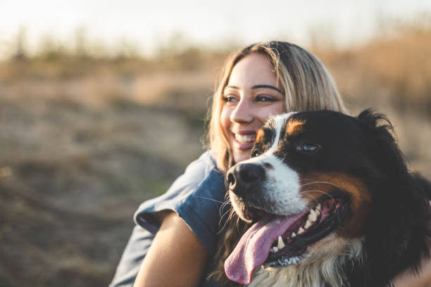 istock Young woman with dog 1263697256