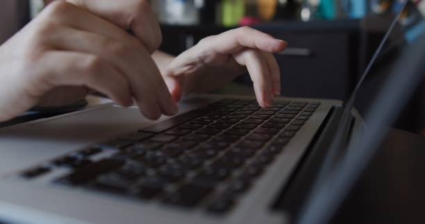 istock Hands of a woman doing office work at home 1263698071