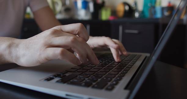 istock Hands of a woman doing office work at home 1263698193