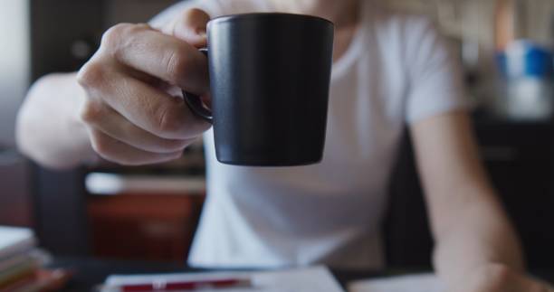 istock Hands of a woman doing office work at home 1263698229