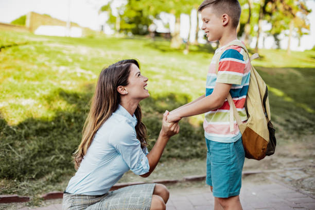 istock Mother accompanies her son to school 1263699282