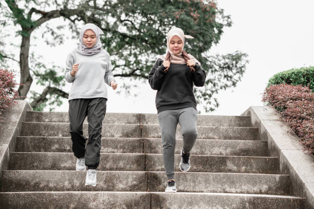 istock Beautiful muslim ladies doing exercise at a public park during a sunny day 1263699325