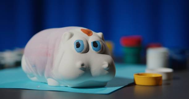 istock Painting a ceramic figurine at home 1263699411