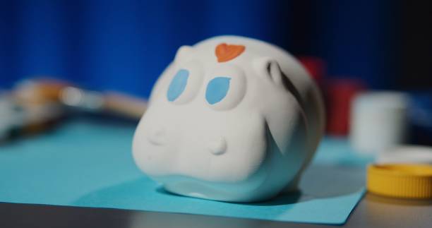 istock Painting a ceramic figurine at home 1263699601