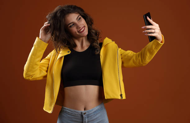 istock A girl taking a selfie with her phone 1263699840