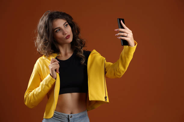istock A girl taking a selfie with her phone 1263699841