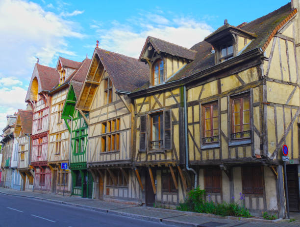 istock five half-timbered yellow and white house 1263699848