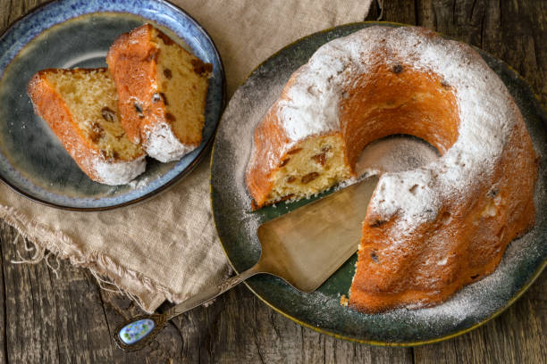 istock Round bundt cake sprinkled with powdered sugar, close-up. 1263700950