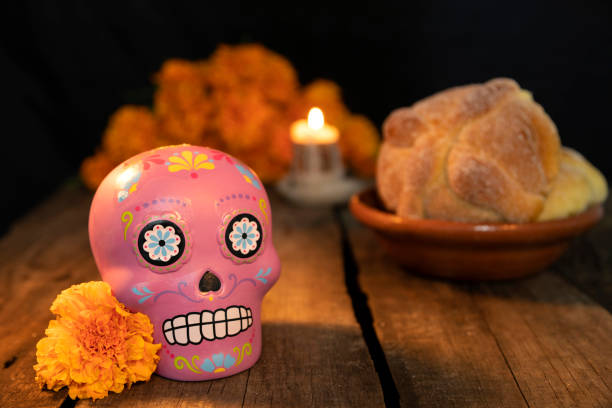 istock Composition with typical Mexican skull and cempazuchitl flowers on rustic wooden table. 1263701325
