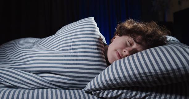 istock Woman is sleeping in bed 1263703457